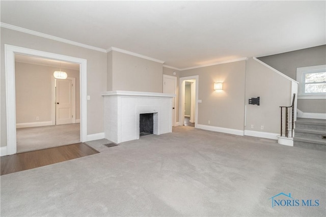 unfurnished living room with crown molding and light colored carpet