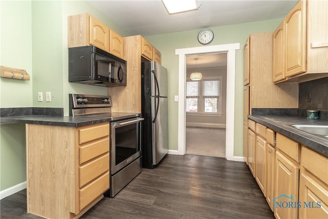 kitchen with dark wood-type flooring, stainless steel appliances, and light brown cabinets