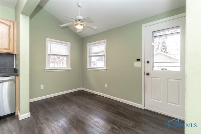 interior space with lofted ceiling, dark hardwood / wood-style floors, and ceiling fan