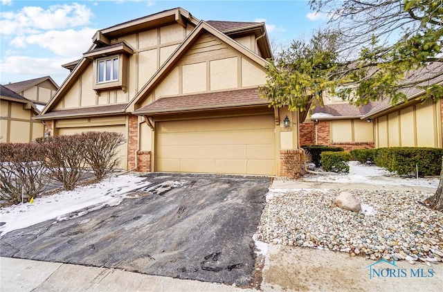 tudor home featuring a garage