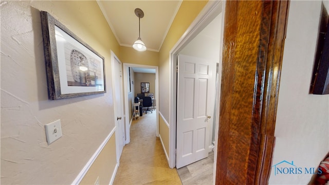 hallway featuring crown molding