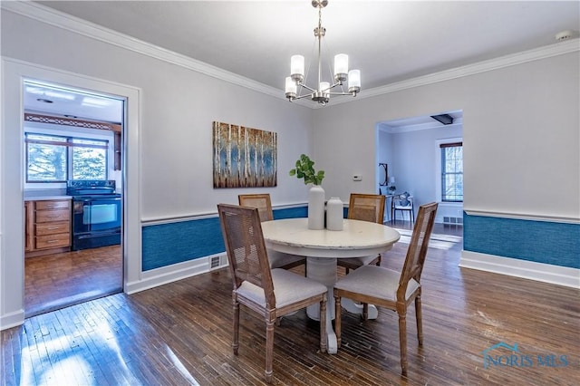 dining space featuring a notable chandelier, crown molding, and dark hardwood / wood-style floors