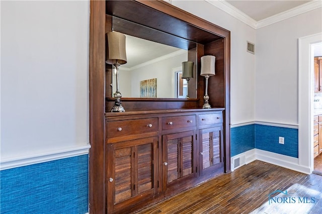 interior space with crown molding and wood-type flooring