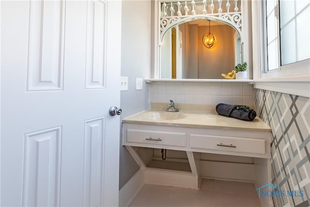 bathroom featuring tasteful backsplash, vanity, and tile patterned flooring