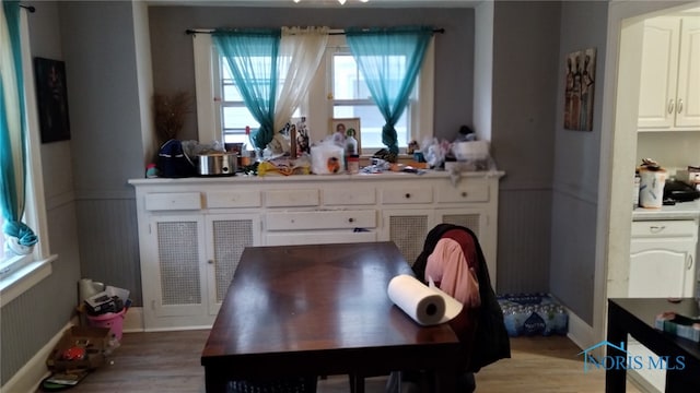 dining space with light wood-type flooring