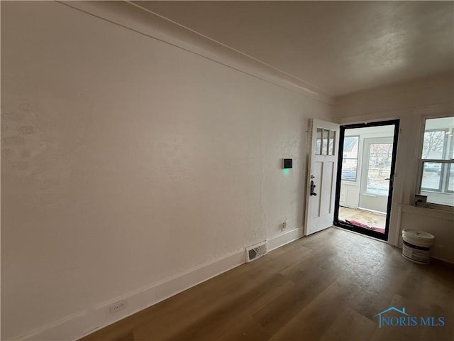 doorway to outside featuring hardwood / wood-style flooring