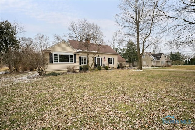 back of house featuring a yard