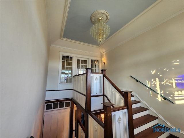 424 Winthrop St, Toledo, OH 43620 - stairway featuring a chandelier, ornamental molding, and a raised ceiling