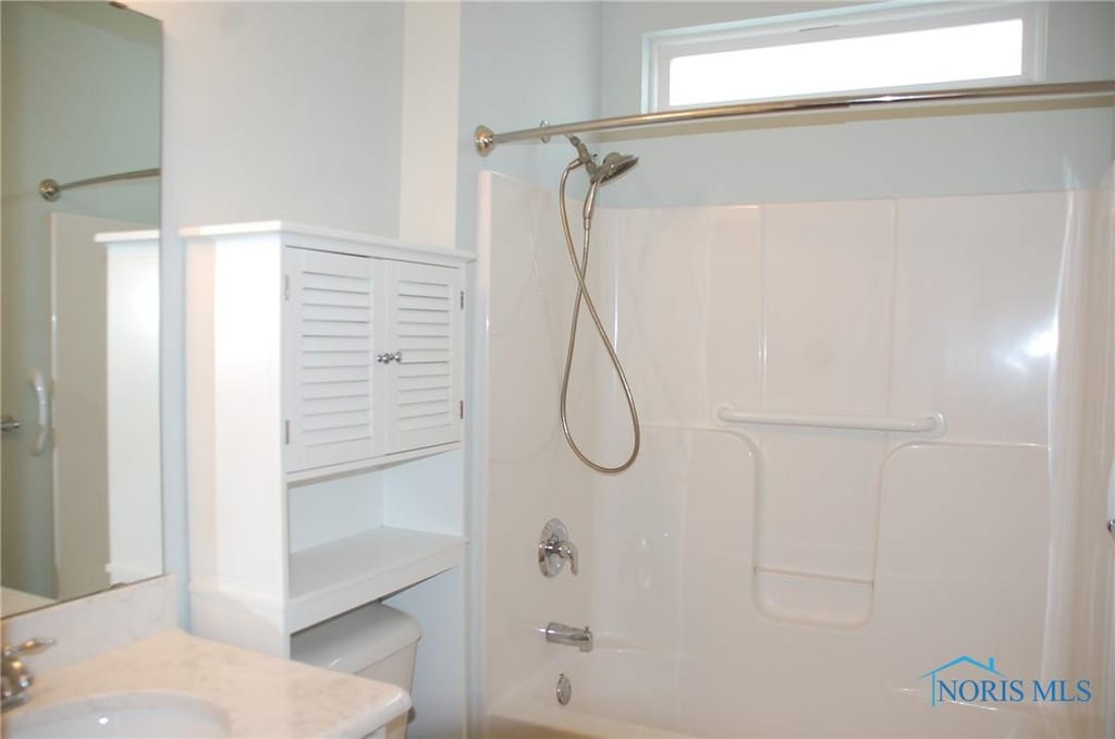 full bathroom featuring vanity, toilet, and bathing tub / shower combination