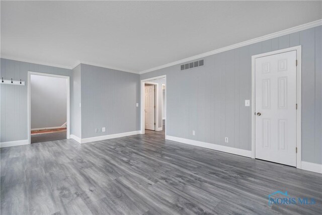 29620 Gleneagles Rd Unit C, Perrysburg, OH 43551 - empty room featuring ornamental molding, wood finished floors, and baseboards