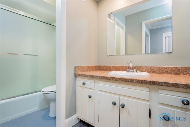 full bathroom with vanity, shower / bath combination with glass door, and toilet