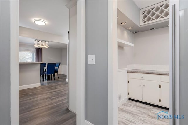 corridor featuring light hardwood / wood-style floors