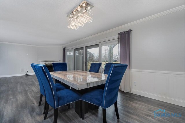 29620 Gleneagles Rd Unit C, Perrysburg, OH 43551 - dining area featuring a chandelier, dark wood-style floors, ornamental molding, and a wainscoted wall