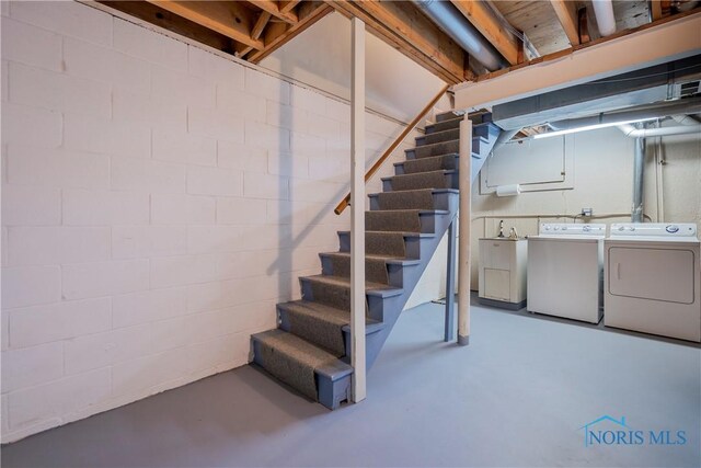 29620 Gleneagles Rd Unit C, Perrysburg, OH 43551 - unfinished below grade area with washing machine and clothes dryer, stairway, concrete block wall, and a sink