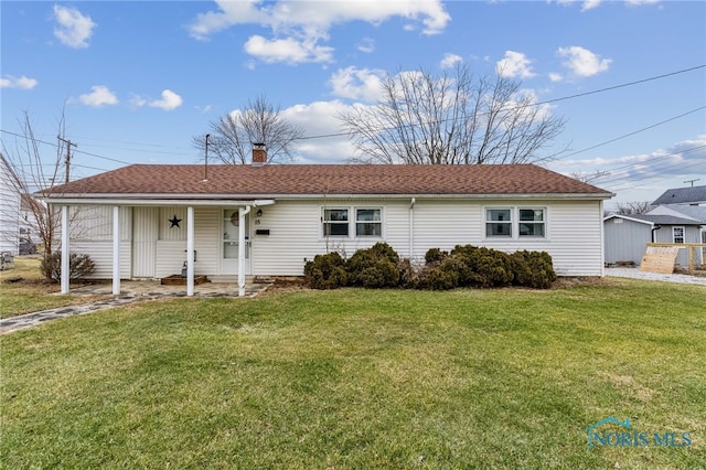 ranch-style home featuring a front yard