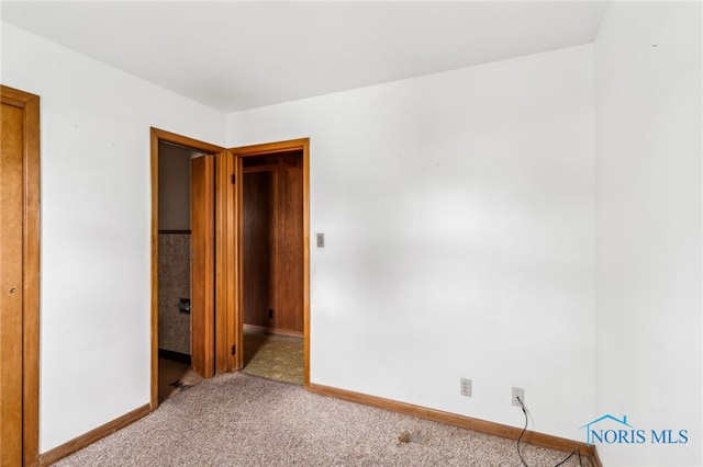 empty room featuring carpet flooring