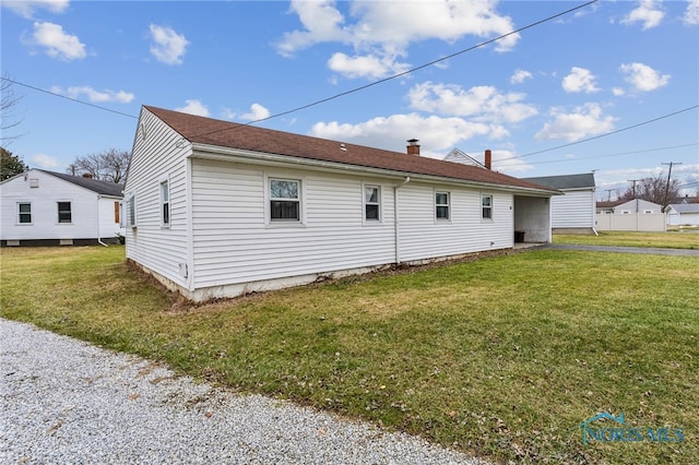 view of property exterior with a lawn