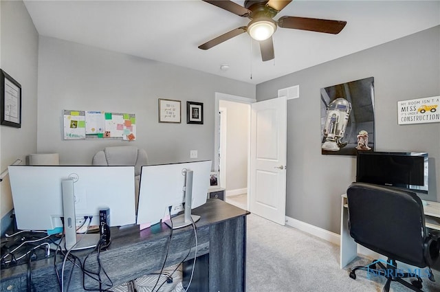 home office with ceiling fan and carpet flooring