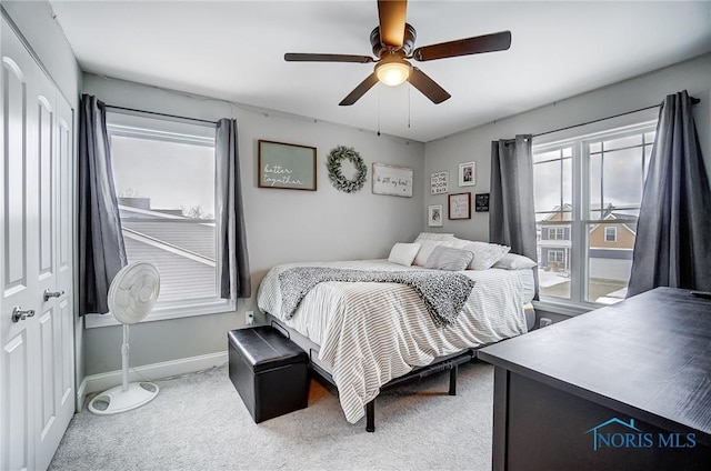 carpeted bedroom featuring ceiling fan