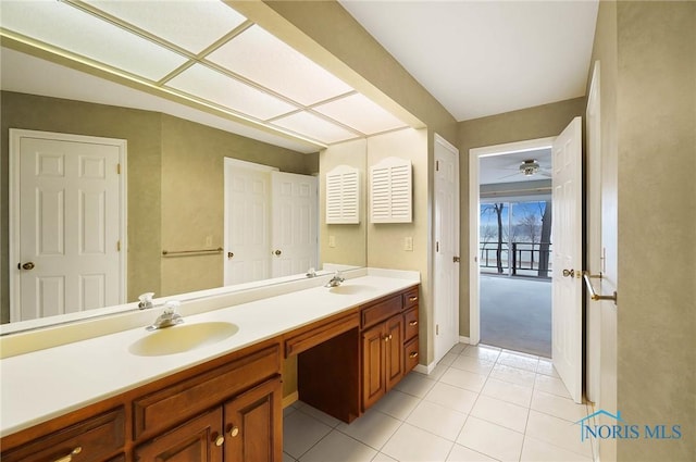 bathroom with ceiling fan, vanity, and tile patterned flooring