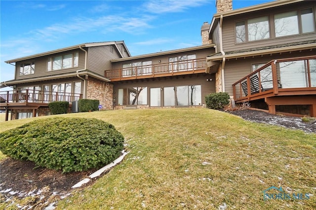 rear view of house with a yard