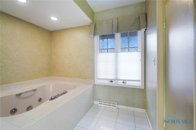 bathroom featuring tile patterned flooring and a tub