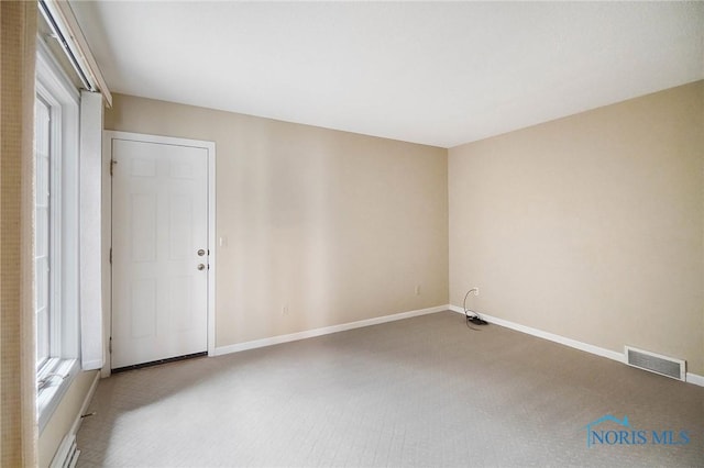 unfurnished room featuring carpet flooring