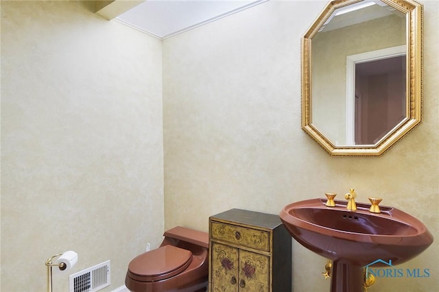 bathroom featuring sink and toilet