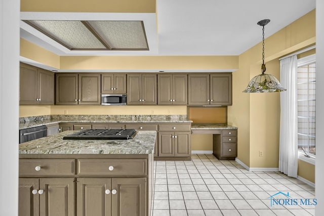 3865 River Rd, Toledo, OH 43614 - kitchen featuring light stone counters, stainless steel appliances, baseboards, light tile patterned floors, and pendant lighting