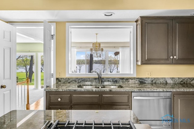 3865 River Rd, Toledo, OH 43614 - kitchen featuring stainless steel dishwasher, an inviting chandelier, dark brown cabinets, dark stone counters, and a sink