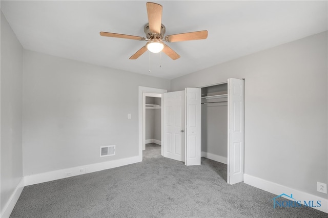 unfurnished bedroom with light colored carpet and ceiling fan