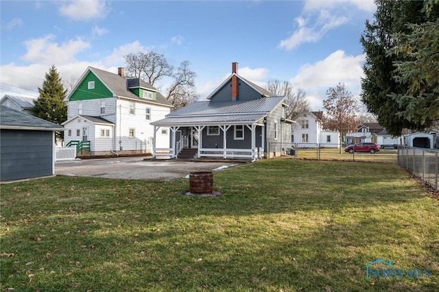 rear view of house with a lawn