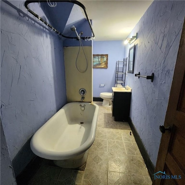 full bathroom featuring bathtub / shower combination, vanity, and toilet