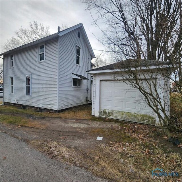 view of property exterior featuring a garage