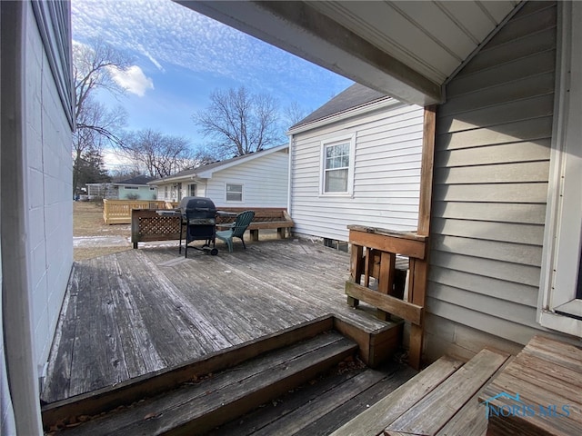 wooden terrace featuring grilling area