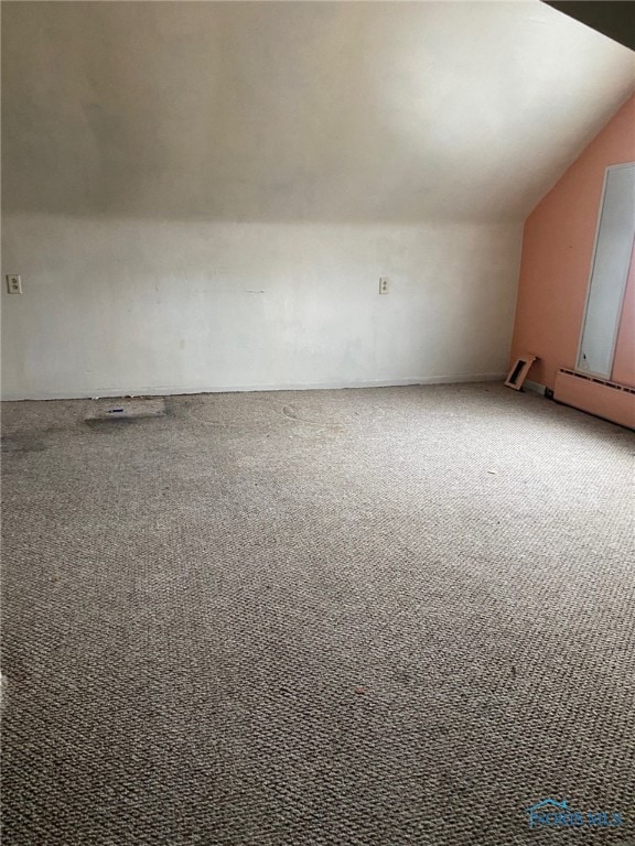 bonus room with baseboard heating, lofted ceiling, and carpet