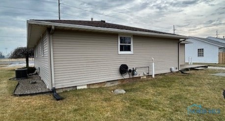 view of home's exterior featuring a yard