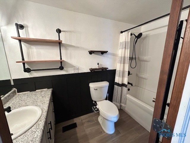 full bathroom with vanity, toilet, and shower / bath combo