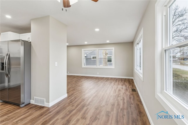 unfurnished living room featuring wood-type flooring