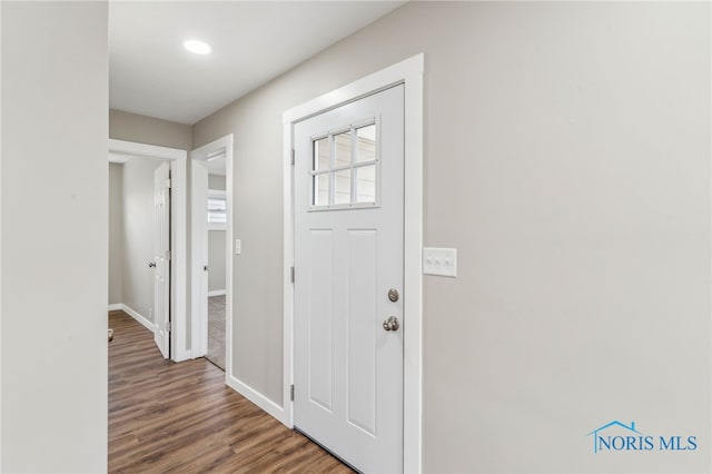 entryway with hardwood / wood-style flooring