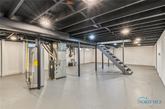 basement featuring heating unit and gas water heater