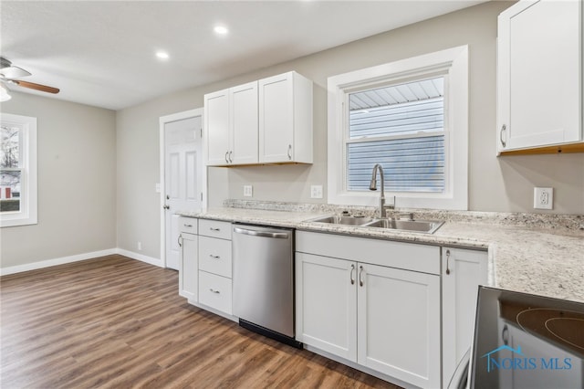 kitchen featuring sink, ceiling fan, white cabinetry, stainless steel appliances, and dark hardwood / wood-style flooring