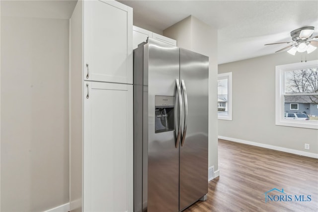 kitchen featuring white cabinetry, stainless steel fridge with ice dispenser, hardwood / wood-style floors, and ceiling fan