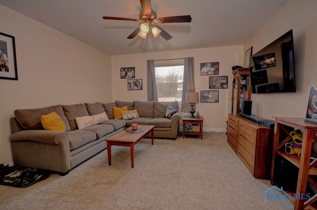 living room featuring light colored carpet and ceiling fan