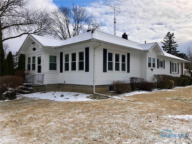 view of snow covered property