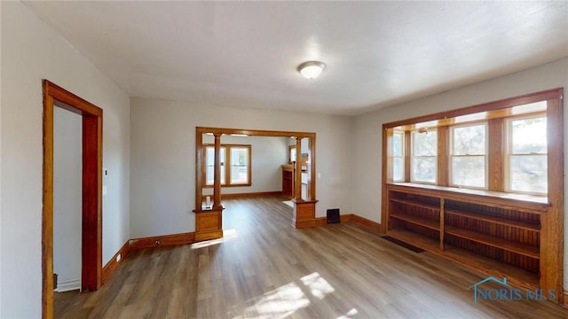 unfurnished room with hardwood / wood-style floors