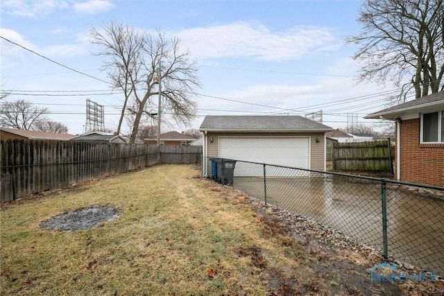 view of yard with a garage and an outdoor structure