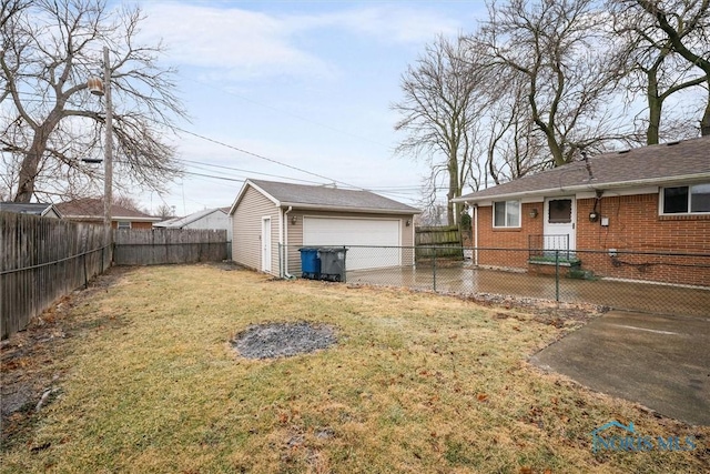 view of yard featuring an outbuilding and a garage