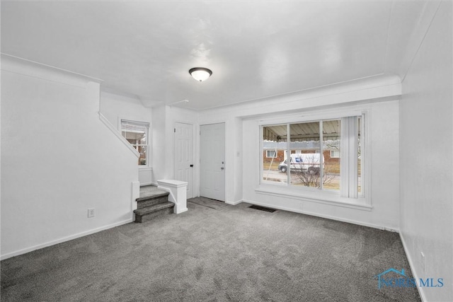 unfurnished living room with carpet floors