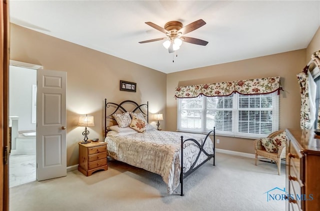 carpeted bedroom featuring connected bathroom and ceiling fan